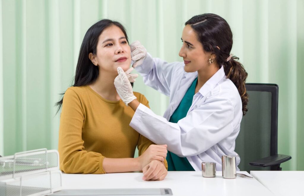 Woman being evaluated by her dermatologist for a combination Botox and dermal filler injection treatment