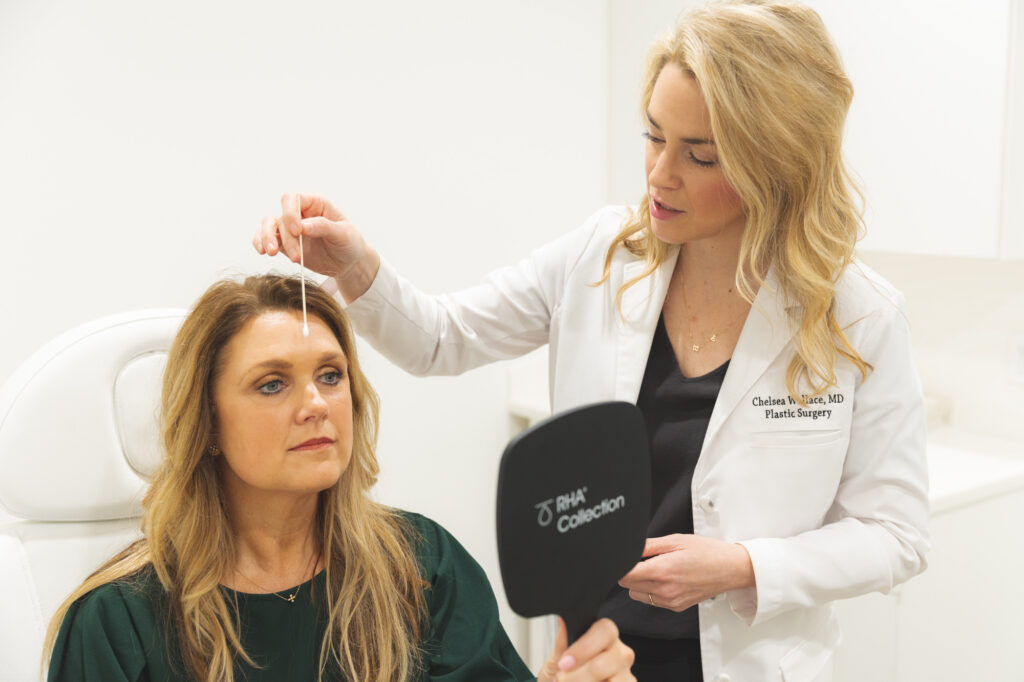 Dr. Wallace Talking to a Patient in a Treatment Room